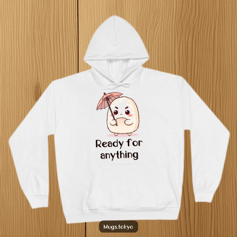 Funny hoodie featuring a cute onigiri character with a determined expression, wielding a tiny umbrella, perfect for staying cozy.