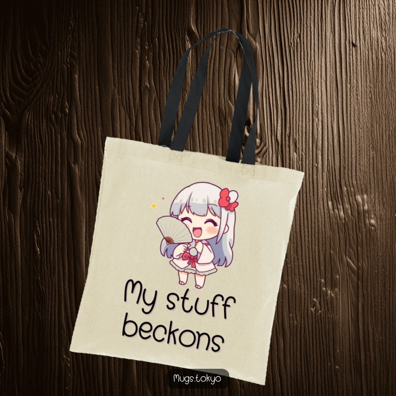 Funny tote bag featuring a cheerful character with a paper fan, playfully beckoning. Stylish and humorous accessory.